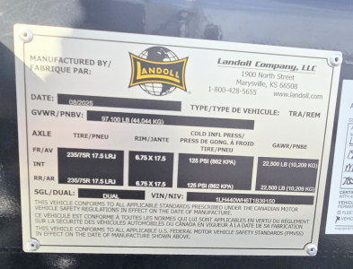 Landoll 40 ton slide axle trailer data plate showing manufacturer details, weights, tire specs, and VIN.