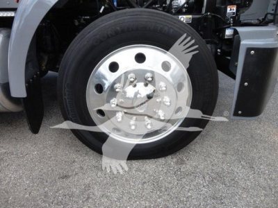 Peterbilt 337 wheel and front fender showing aluminum dual rear wheels and hub with lug nuts.
