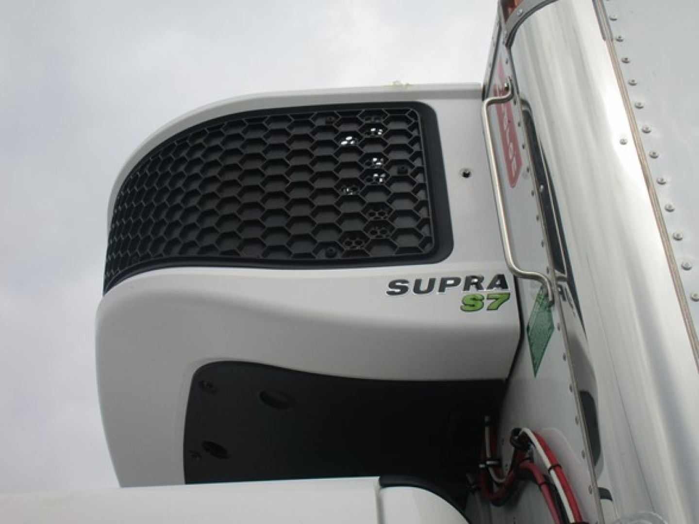  Freightliner truck front grille and side door showing Supra S7 badge on the bumper of a new 2026 Freightliner Business Class M2 106 Plus refrigerated truck.