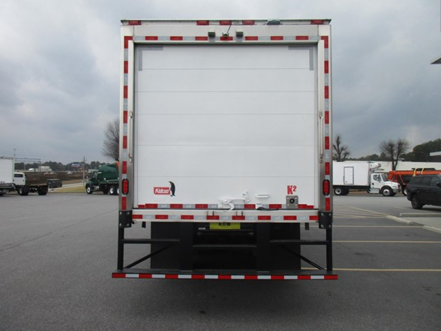 Freightliner M2 106 Plus refrigerated box truck rear view showing rear doors and bumper.