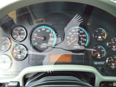 Dashboard of a 2019 International Durastar 4300 showing gauges including RPM, MPH, water, volts, fuel; odometer not readable; small digital display area with 'Miles' label.