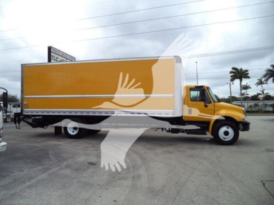 Truck side view showing a yellow 2019 International Durastar 4300 box truck with a large cargo box