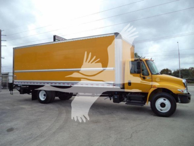 Box truck with yellow cargo box and white stripe, International 4300, side view showing cab and chassis.