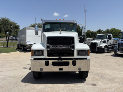 Front view of white 2027 Mack PI64 dump truck showing Mack grille, bumper, and headlights.