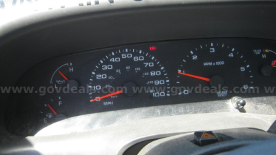 Dashboard view of a Ford F-550 showing speedometer, tachometer, and gauges; text includes Ford VIN label area and gauge markings.