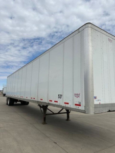 Trailer van side view showing 53' length marking and aluminum riveted panels.