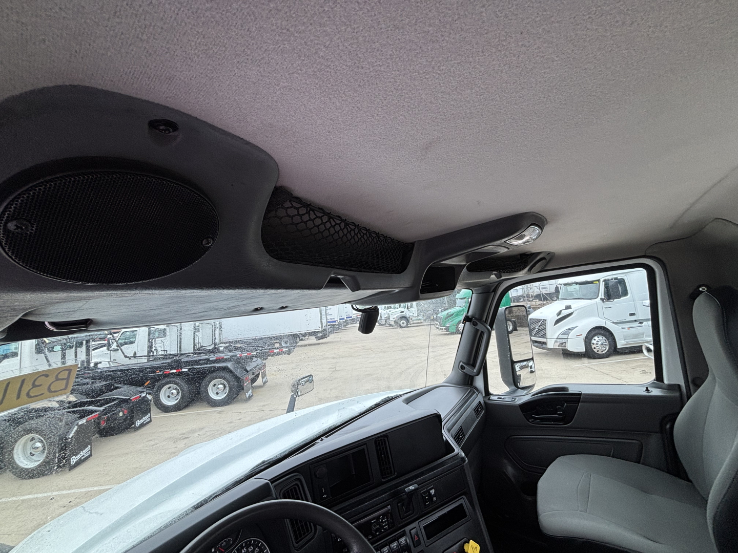 Interior cab view of a 2019 International LT truck, with dashboard controls and steering wheel visible. There are no legible model badges or text clearly visible in the image.