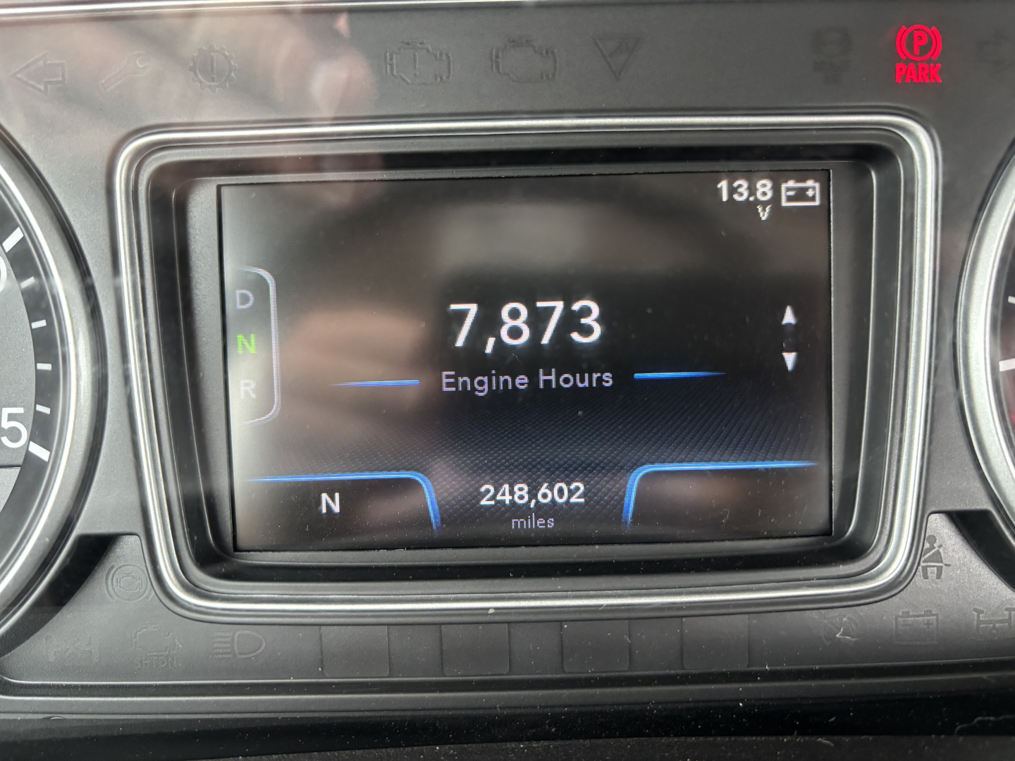 Instrument cluster showing 7,873 engine hours and 248,602 miles in a 2019 International LT dashboard display.
