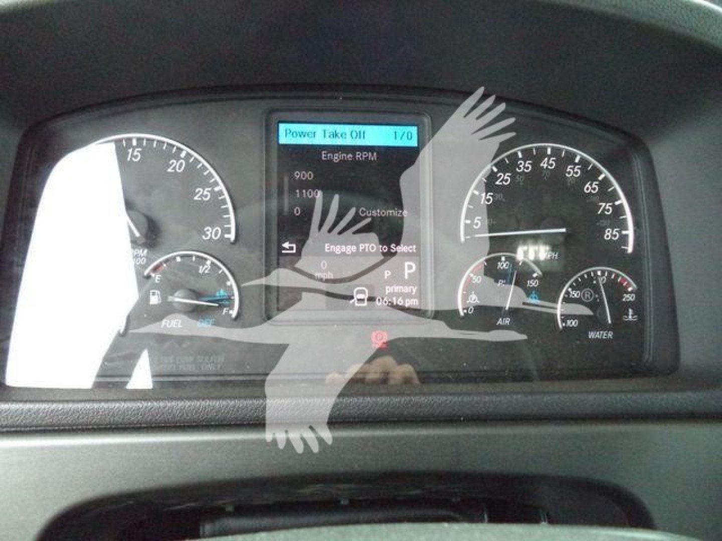 Dashboard of a 2025 Freightliner M2 106 showing instrument cluster and center display. Visible gauges for RPM, speed, fuel, engine status, and drive indicators.