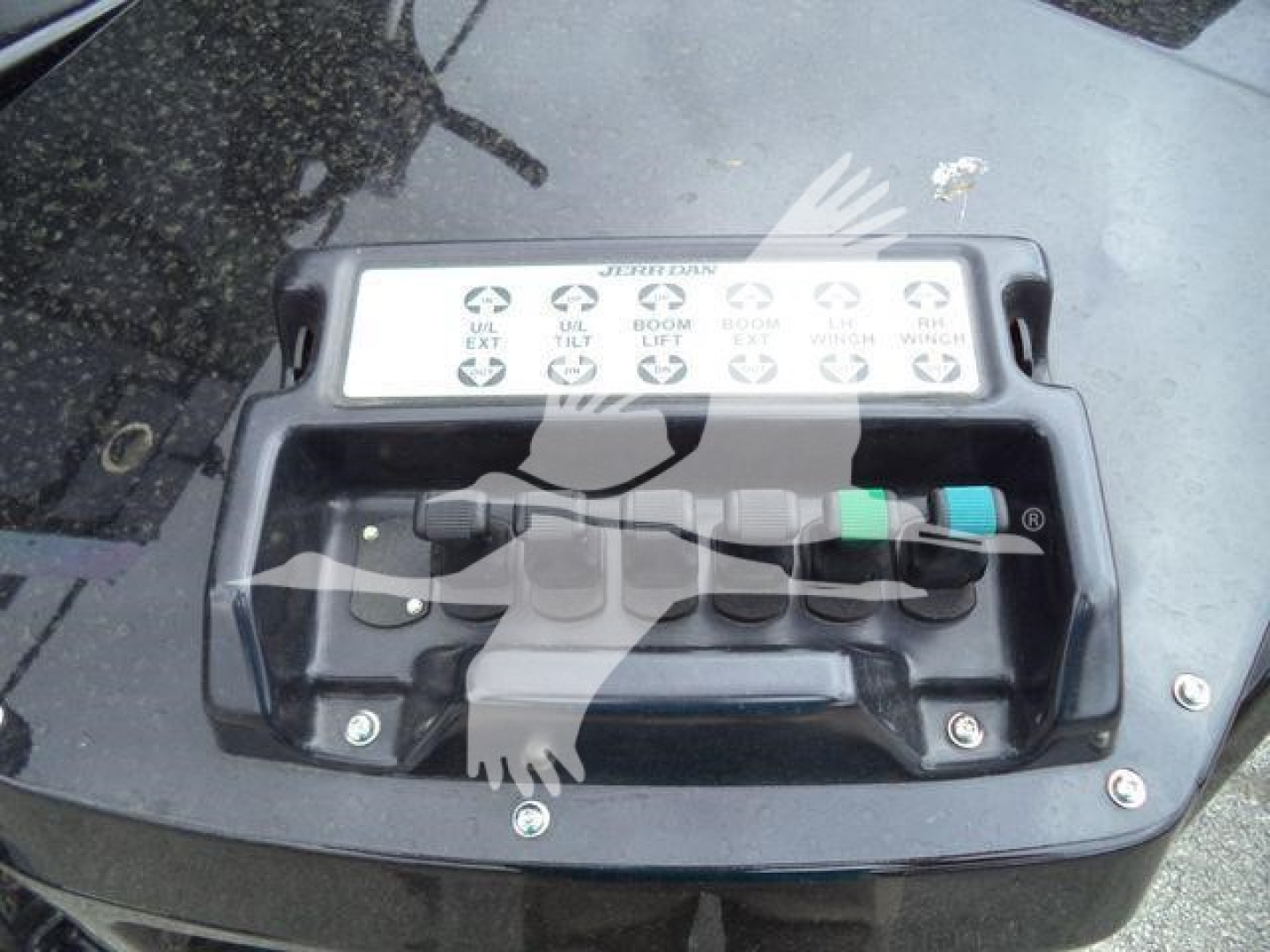 Winch control panel on Freightliner M2 106 showing multiple labeled levers and colored safety caps.