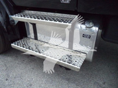 Freightliner M2 106 exterior side step with perforated metal steps and winch equipment area visible.