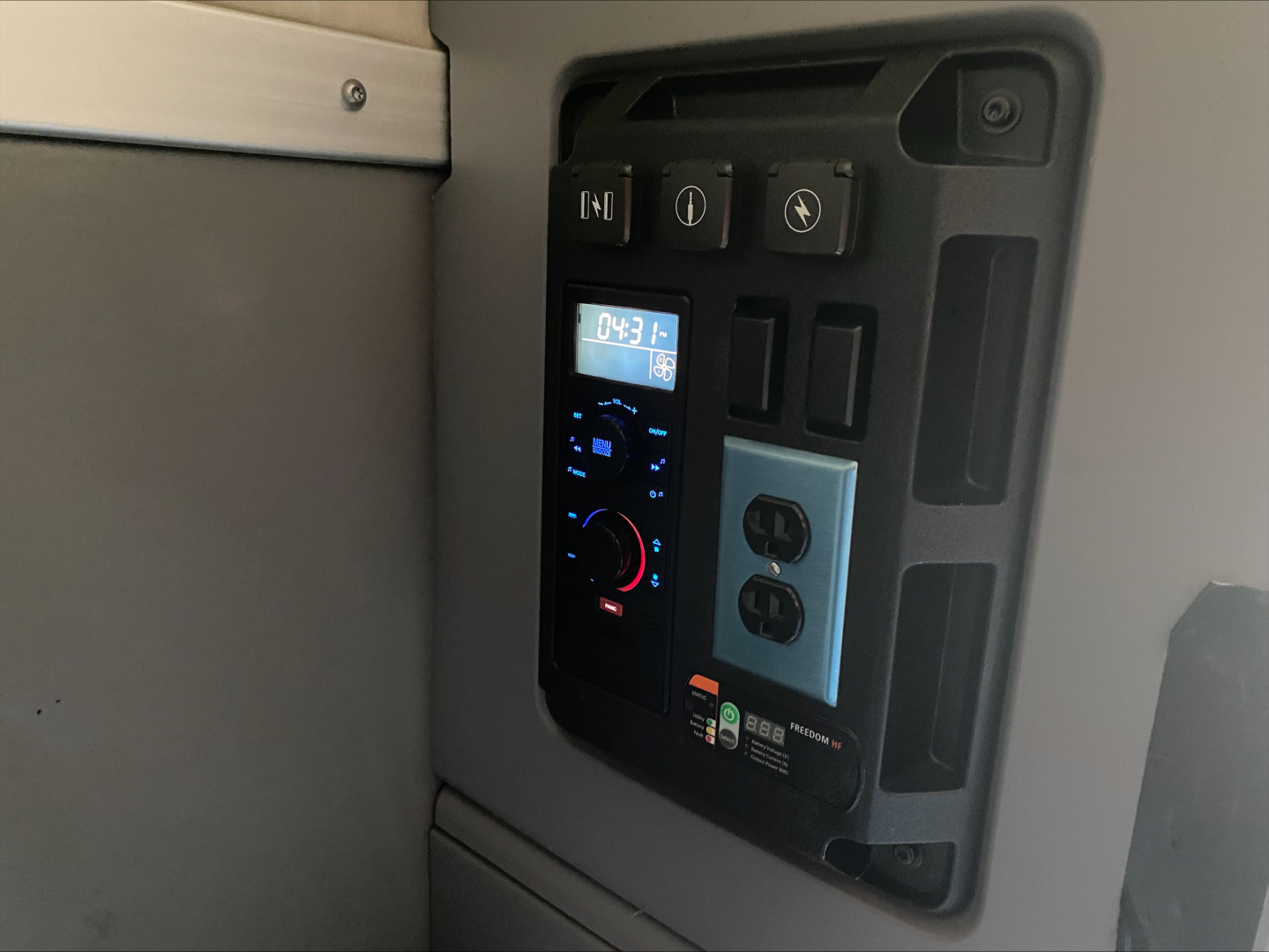 Cab interior control panel and auxiliary switches in a Mack Anthem truck sleeper cabin.