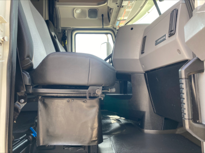 Cab interior of a 2020 Mack Anthem truck with driver seat and dashboard visible