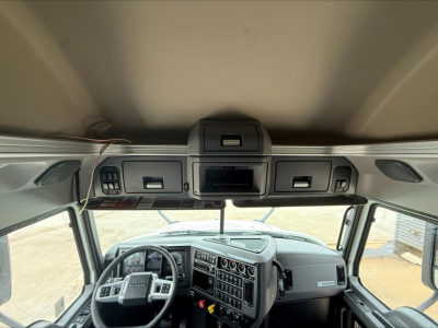 Cab interior of a 2020 Mack Anthem truck showing dashboard with numerous gauges and control panels, steering wheel, overhead console, and sun visors.