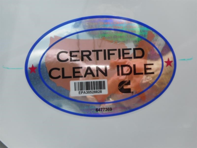 Certified Clean Idle sticker with barcode and serial numbers on a white surface.