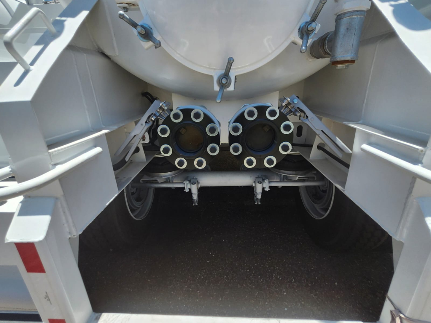 Vacuum trailer rear with twin circular inlet ports and mounting hardware visible