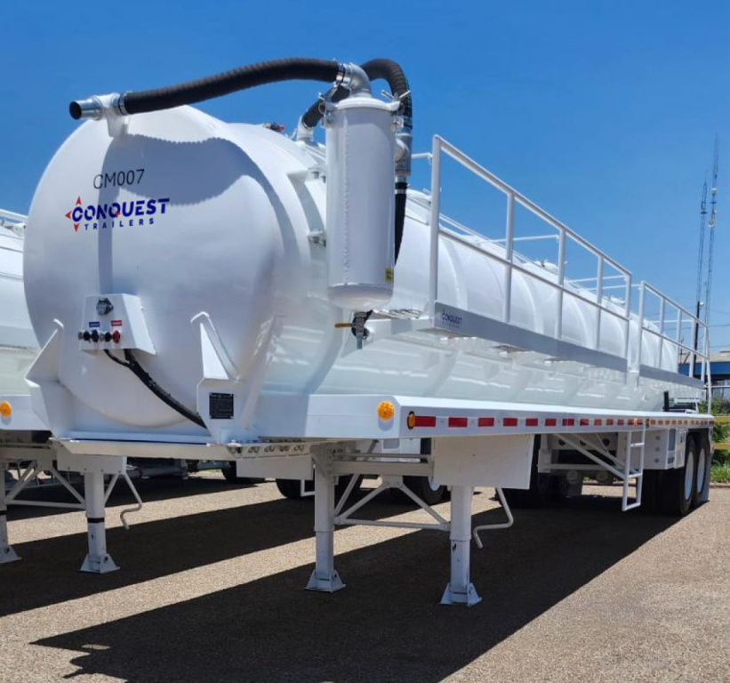 Conquest Vacuum Trailers 130BBL tank trailer with white steel vacuum tank and dual rear axles, labeled QMQ07 Conquest Vacuum Tanks, side railing and pump unit visible.