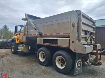 Dump truck with plow and wing showing bed and rear taillights