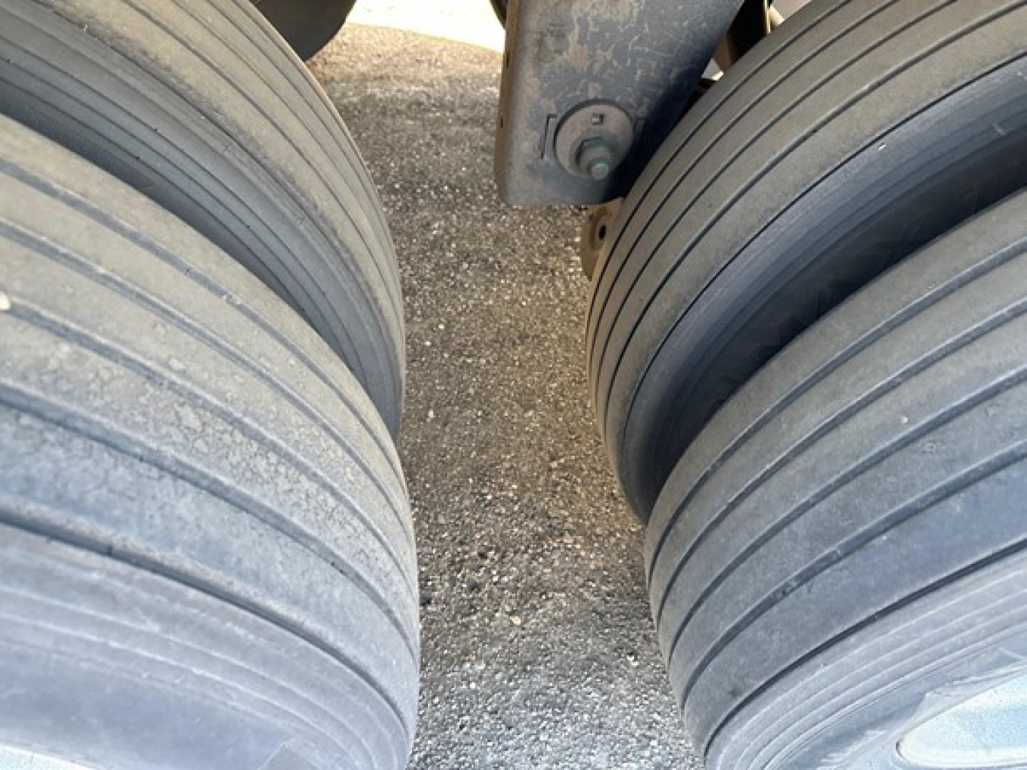Trailer tires and undercarriage showing dual tires on a 2013 Utility 3000R trailer wheel area.