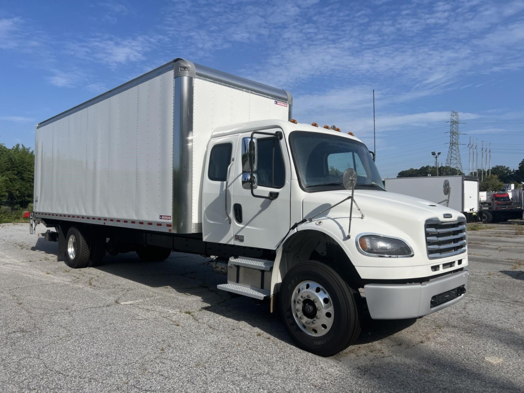 Freightliner M2 106 Plus box truck in serviceable condition with white cab and cargo box, side view, VIN 3ALACWFE4VDXE4989.