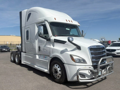 Freightliner Cascadia126 tractor-trailer in white with front bull bar and chrome mirrors, leading edge of cab, side fuel tanks, 6-wheel tractor.
