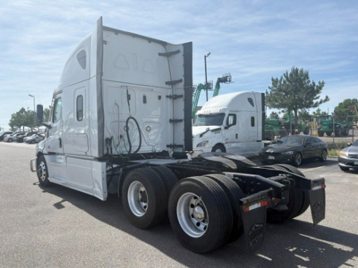 Freightliner Cascadia126 tractor-trailer chassis rear view showing dual rear axles and fifth-wheel mounting platform.