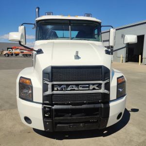 Front view of a white 2019 Mack Anthem truck showing bold grille with MACK emblem, headlights, bumper, and side mirrors.