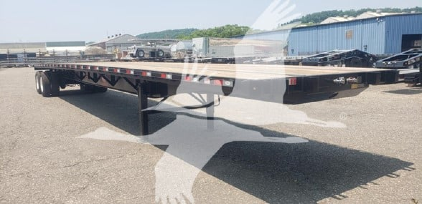 Flatbed trailer: Dorsey air sliding tandem with long flat deck, no visible branding text.