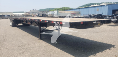 Flatbed trailer showing steel air sliding tandem with black frame and long deck, VIN 7KYFB4823TED46984 and TED46984 stock number.