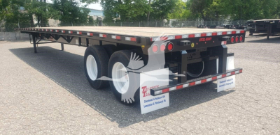 Dorsey steel air sliding tandem trailer showing flatbed and dual axle with white wheels and rear bumper lights.