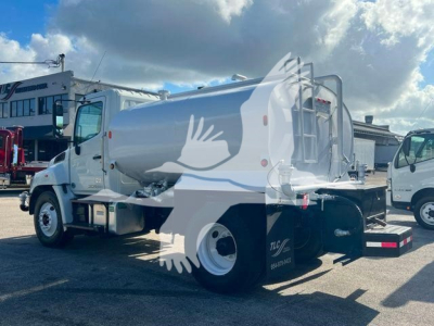 2019 Hino 338 vacuum/ liquid service truck side and rear view showing cylindrical tank with rear ladder and dual rear tires.