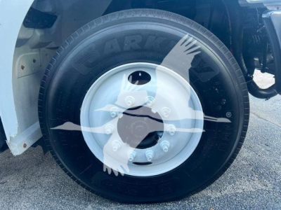 Wheel and tire of a 2019 Hino 338 truck showing a Goodyear tire and steel rim with lug nuts.