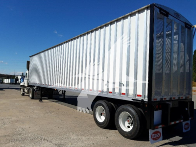Open top trailer by Dorsey with metal ribbed sides and dual rear doors; long trailer on a lot with clear blue sky.