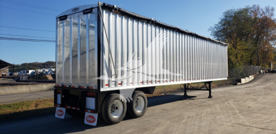 Open top trailer showing aluminum side walls and dual rear wheels. VIN 7KYCV4526VED51498 stock VED51498.