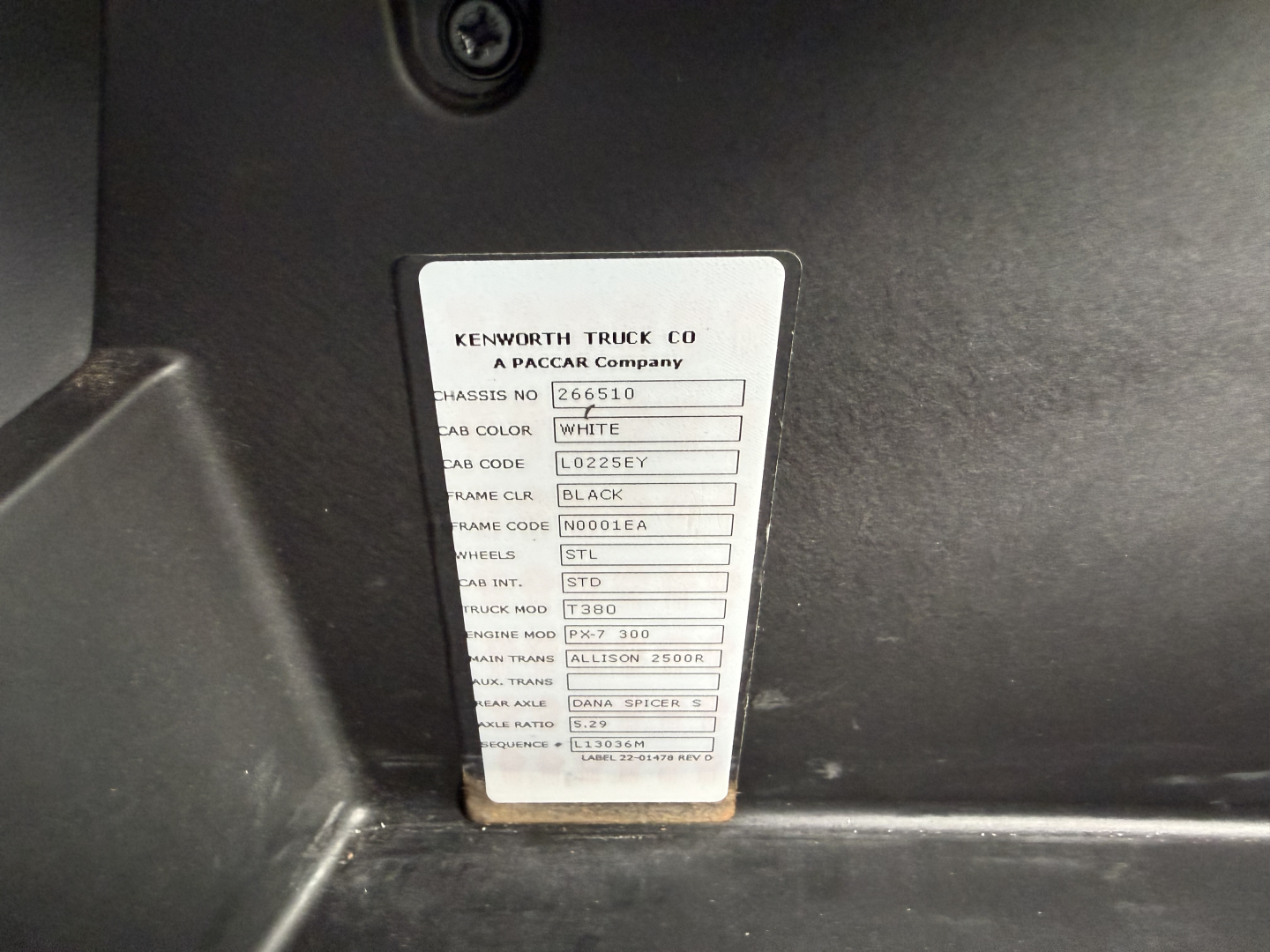 Kenworth truck label with chassis, color, and model codes; text includes WHITE, BLACK, T380, ALLISON 2500, and other specs.