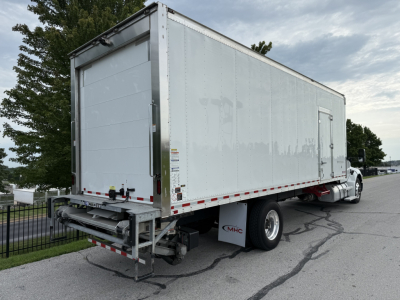 Kenworth T380 refrigerated truck rear and side view showing cargo box and rear bumper.