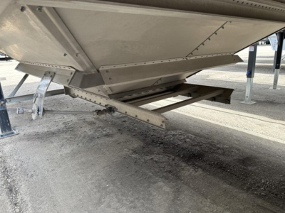 Trailer landing gear and undercarriage of a 2025 Stoughton air ride grain trailer showing structural framework and support beams.