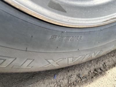 Wheel and tire of a Stoughton trailer showing Goodyear Marathon? tire markings with size 11R22.5 and 11R22.5 inscription and wheel hub.