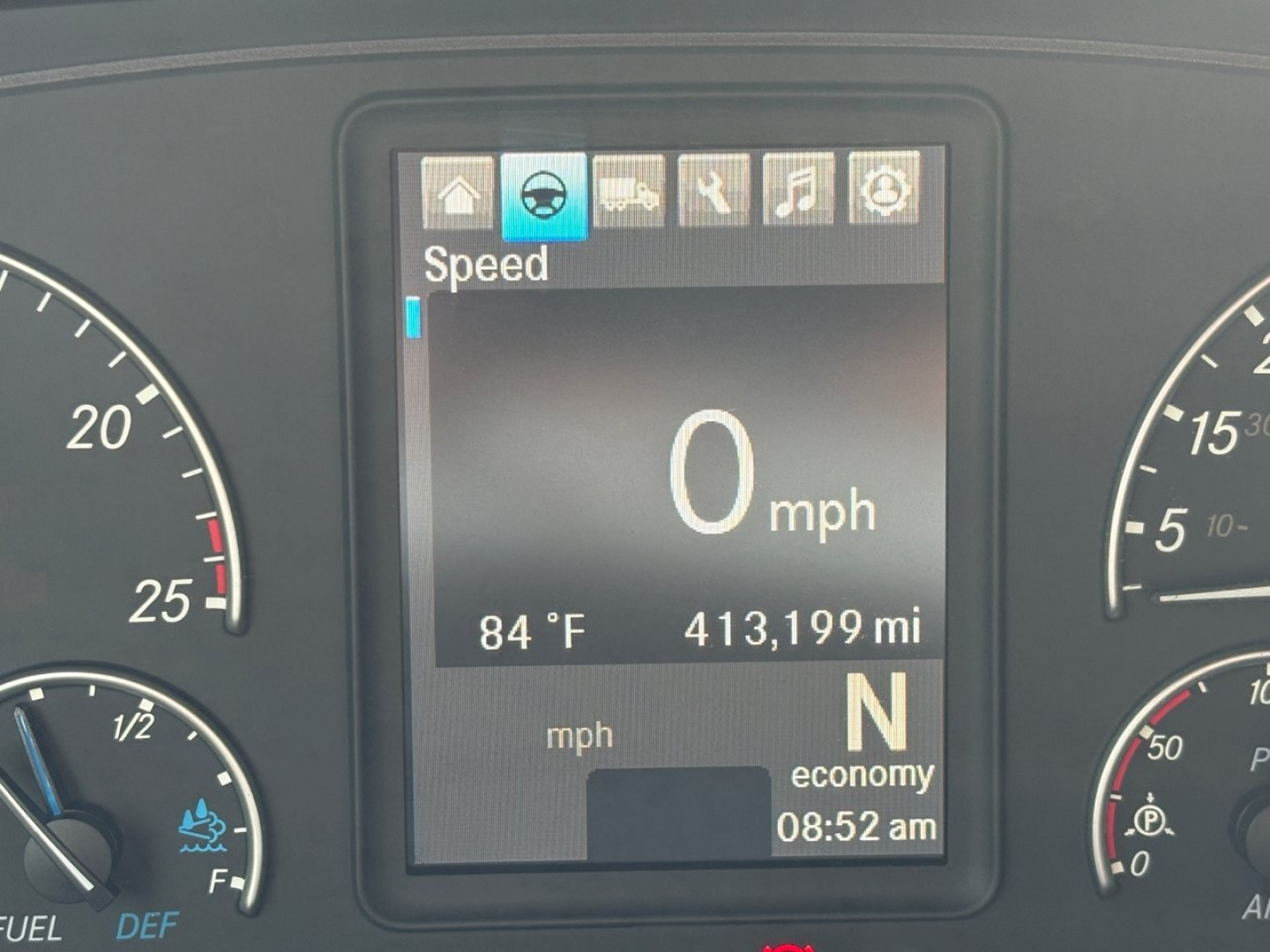 Freightliner Cascadia 126 dashboard display showing speed 0 mph, 413,199 miles, engine gauge panels, gear indicator N, time 08:52 am, outside temperature 84°F.