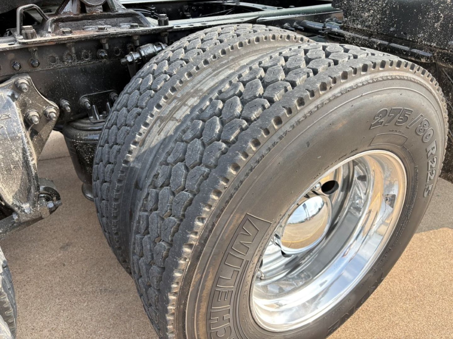 Freightliner Cascadia 126 tractor dual rear tires showing Michelin tires and chrome wheel