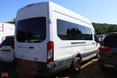 Ford Transit van rear three-quarter view showing side window, rear doors, and taillights.