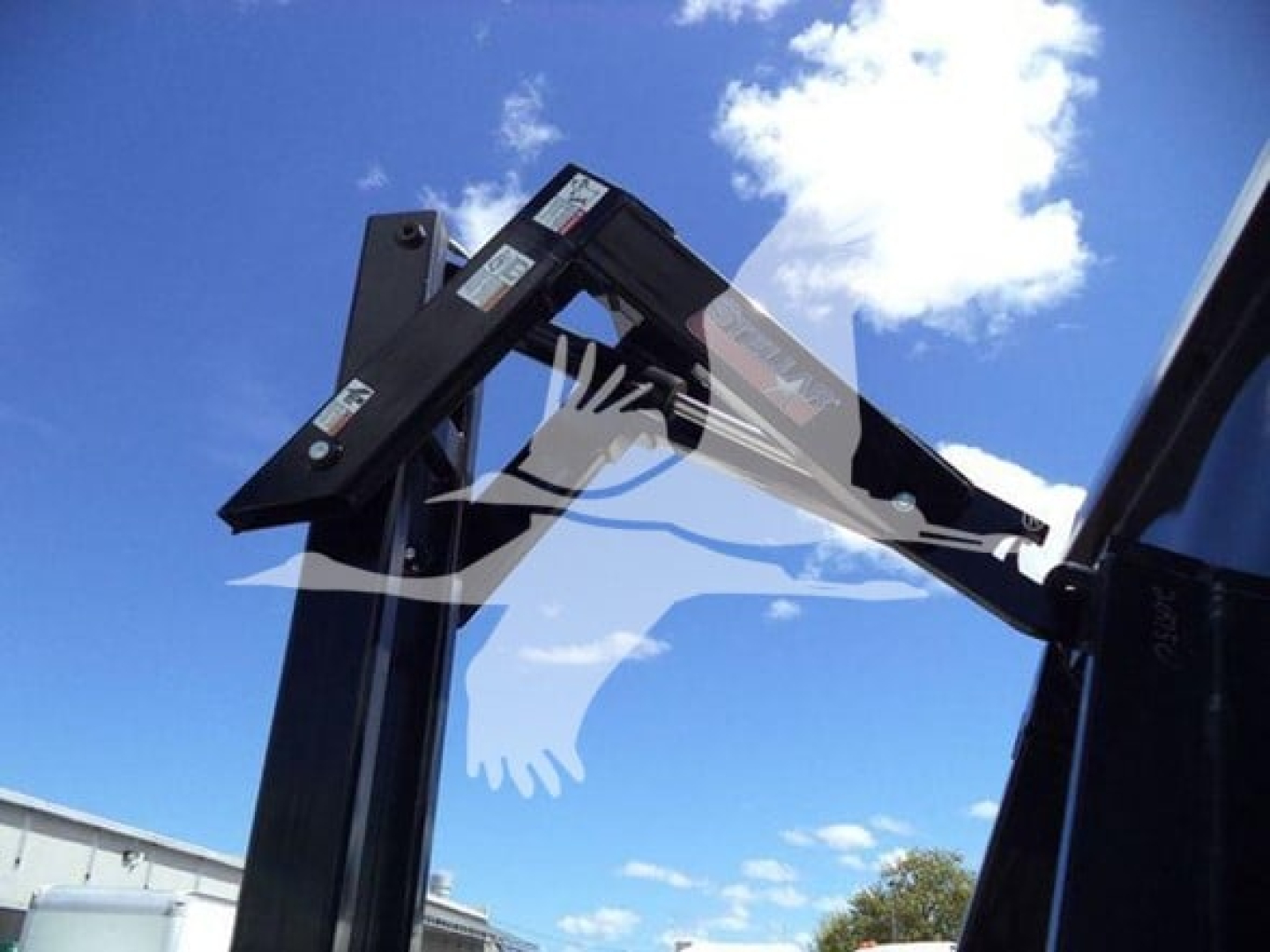 Isuzu NPR HD hooklift truck component showing hydraulic lift arm and frame with labels.