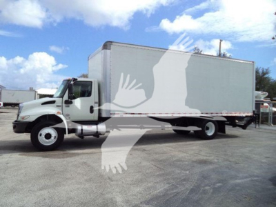 Box truck side view showing 2020 International MV box truck with white cab and large box body.