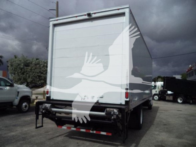 Box truck rear view showing plain white cargo area and taillights; no legible labels or text visible.