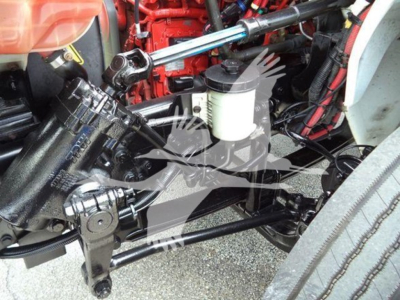Box truck front suspension and engine bay components visible in a used 2020 International MV truck with red engine block and hydraulic lines.