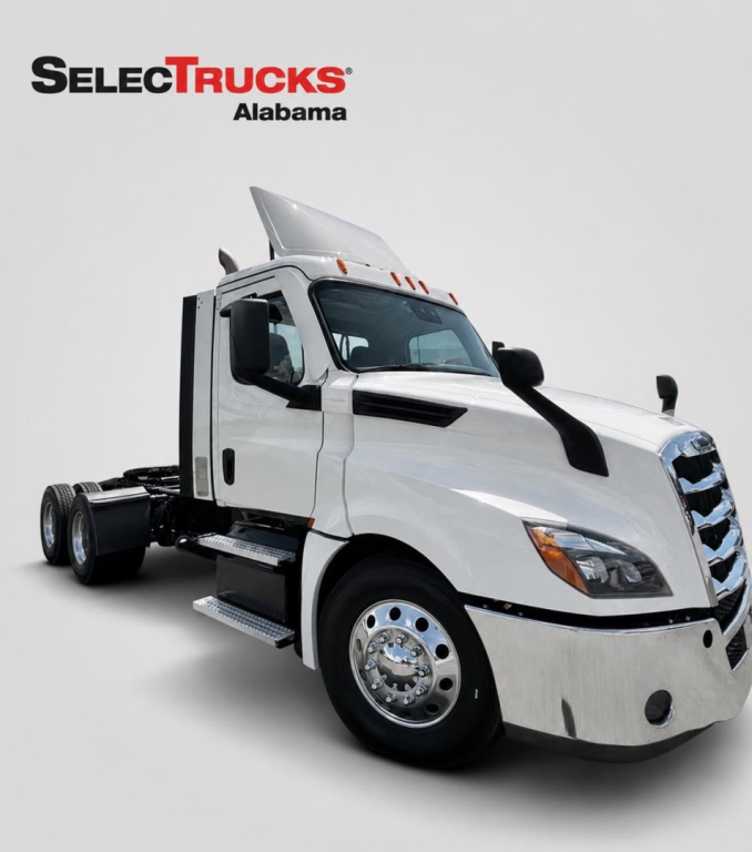 Truck cab chassis showing Freightliner Cascadia with empty rear dual axle, chrome wheels, white exterior, daytime cab; SelecTrucks Alabama logo in corner.