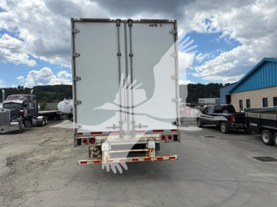 Back view of a 2013 Great Dane swing door trailer with side door. Visible text includes '6D8 0' on top rear and nozzle/hinges. Damaged rear bumper and red reflectors.