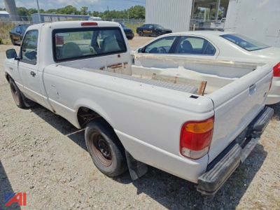 1999 Ford Ranger pickup truck in white, rear/side view showing rust-free-looking bed with metal utility rack and single cab, 2wd
