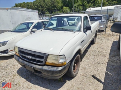 Ford Ranger pickup truck in a used lot, white cab, long bed, front view with black bumper and yellowing headlights.