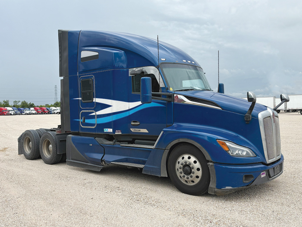 Kenworth T-680 Next Gen conventional sleeper truck in blue showing side profile and wheel configuration.